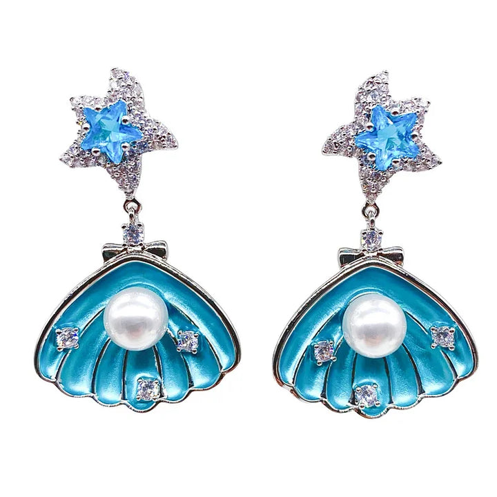 Brincos de conchas cravejadas de diamantes e pérolas