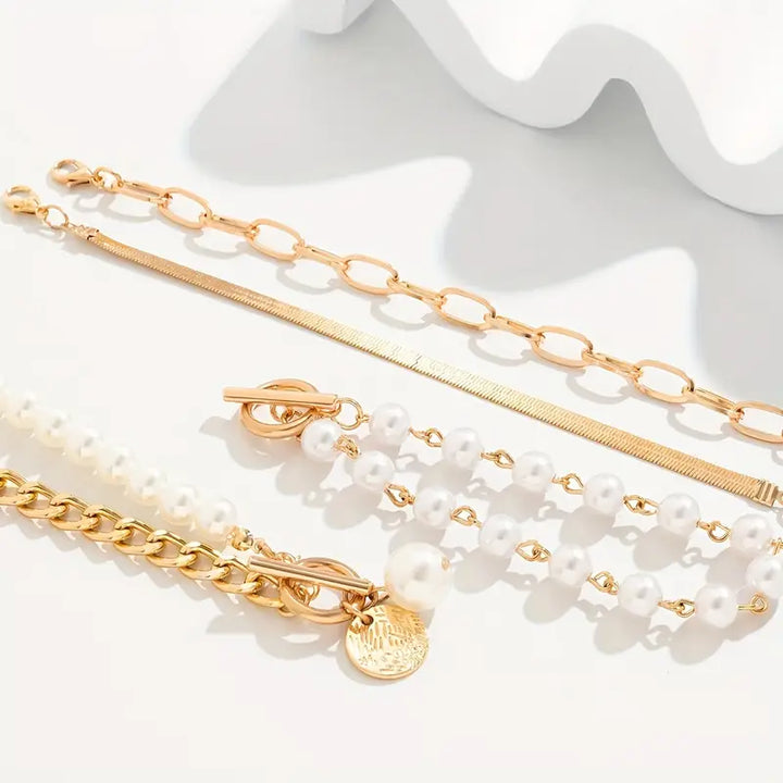 Conjunto de Pulseiras Chic Douradas com 4 Peças – Cobra, Pérolas e Elos