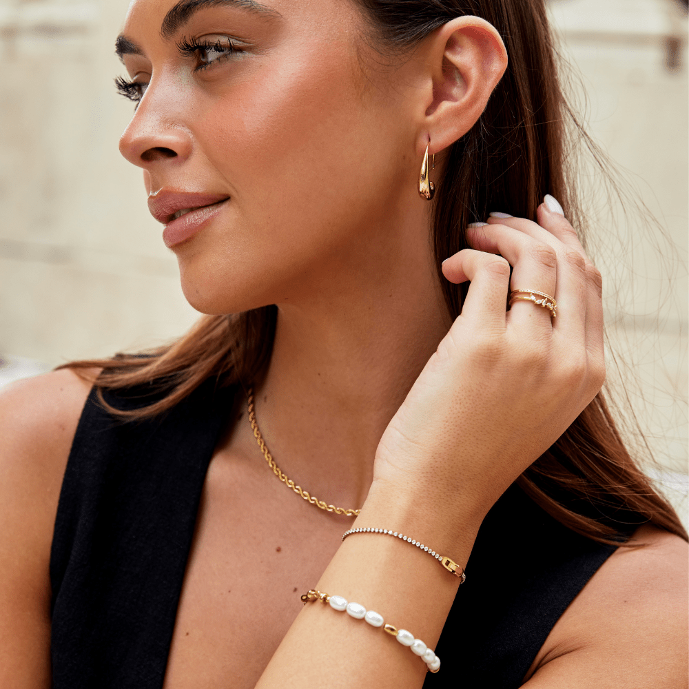 Pulseira Niyah de Cristal Branco com Detalhes em Ouro