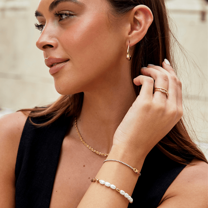 Pulseira Niyah de Cristal Branco com Detalhes em Ouro