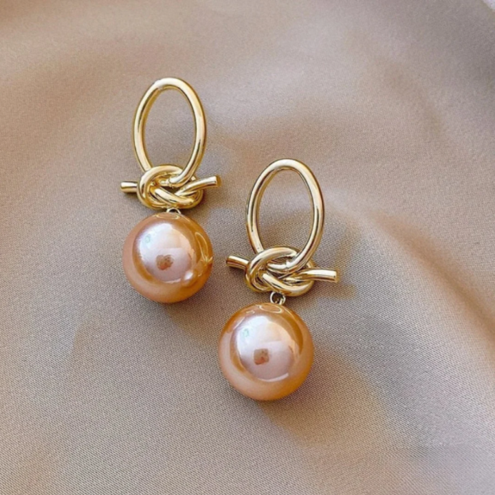 Brincos com Pérola em Laço Dourado